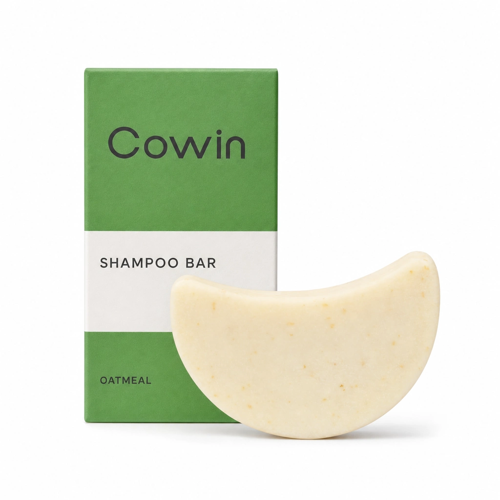 Cowin ivory crescent-shaped shampoo bar beside a green carton