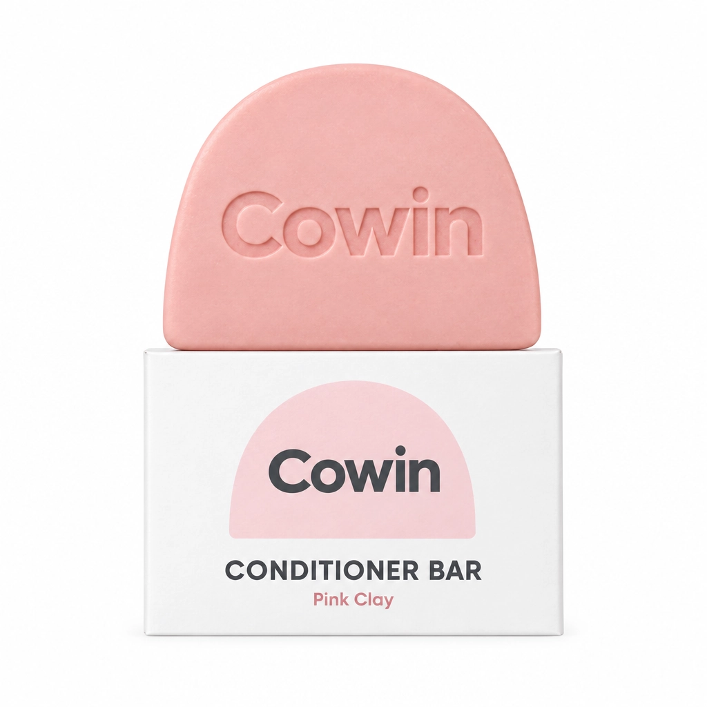 Cowin pink arch-shaped conditioner bar on a white carton