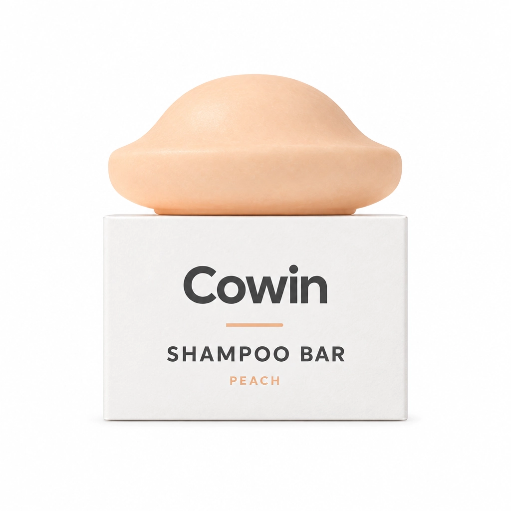 Cowin peach sculpted shampoo bar on a white carton
