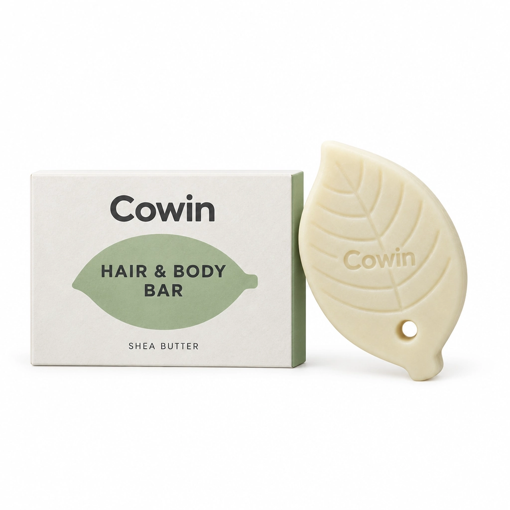 Cowin ivory leaf-shaped hair and body bar beside a white carton