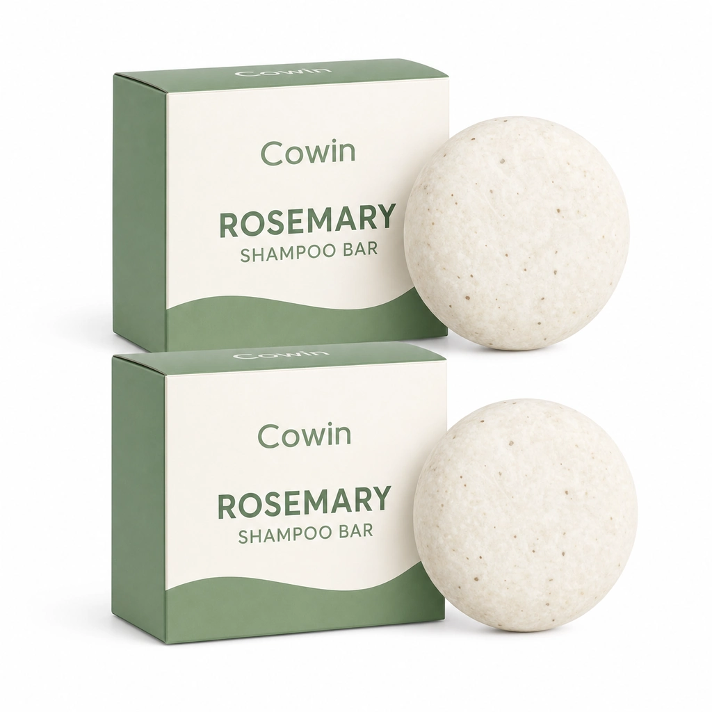 Cowin two speckled ivory round shampoo bars with green and white cartons
