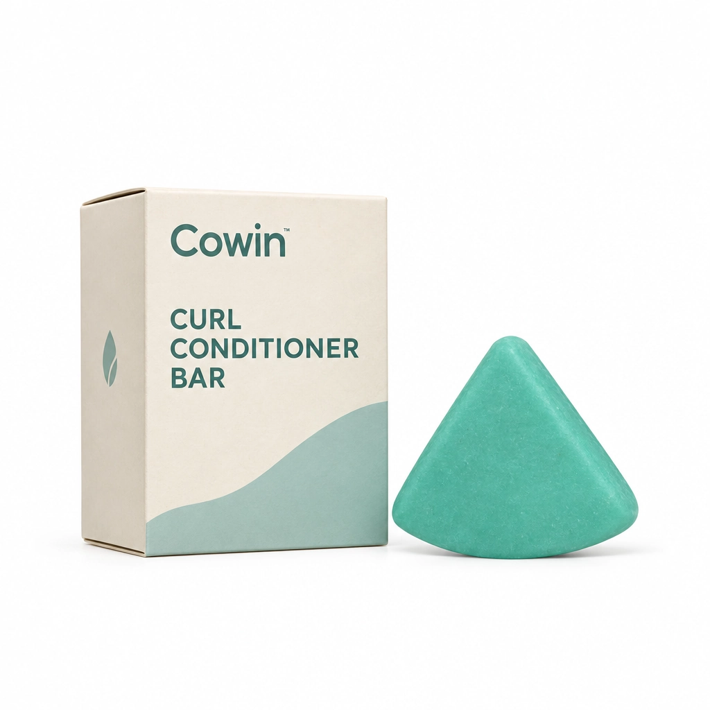 Cowin teal triangular conditioner bar beside a white and teal carton