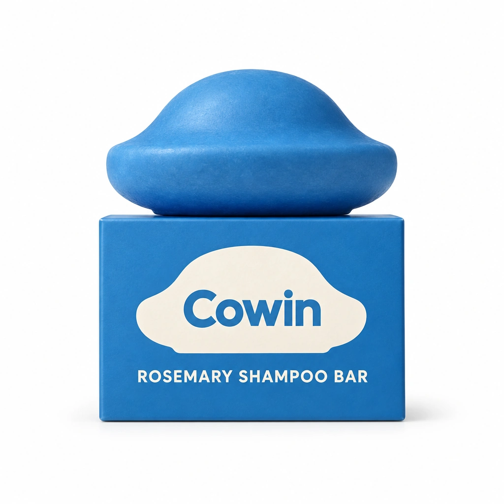 Cowin blue sculpted shampoo bar on a blue carton