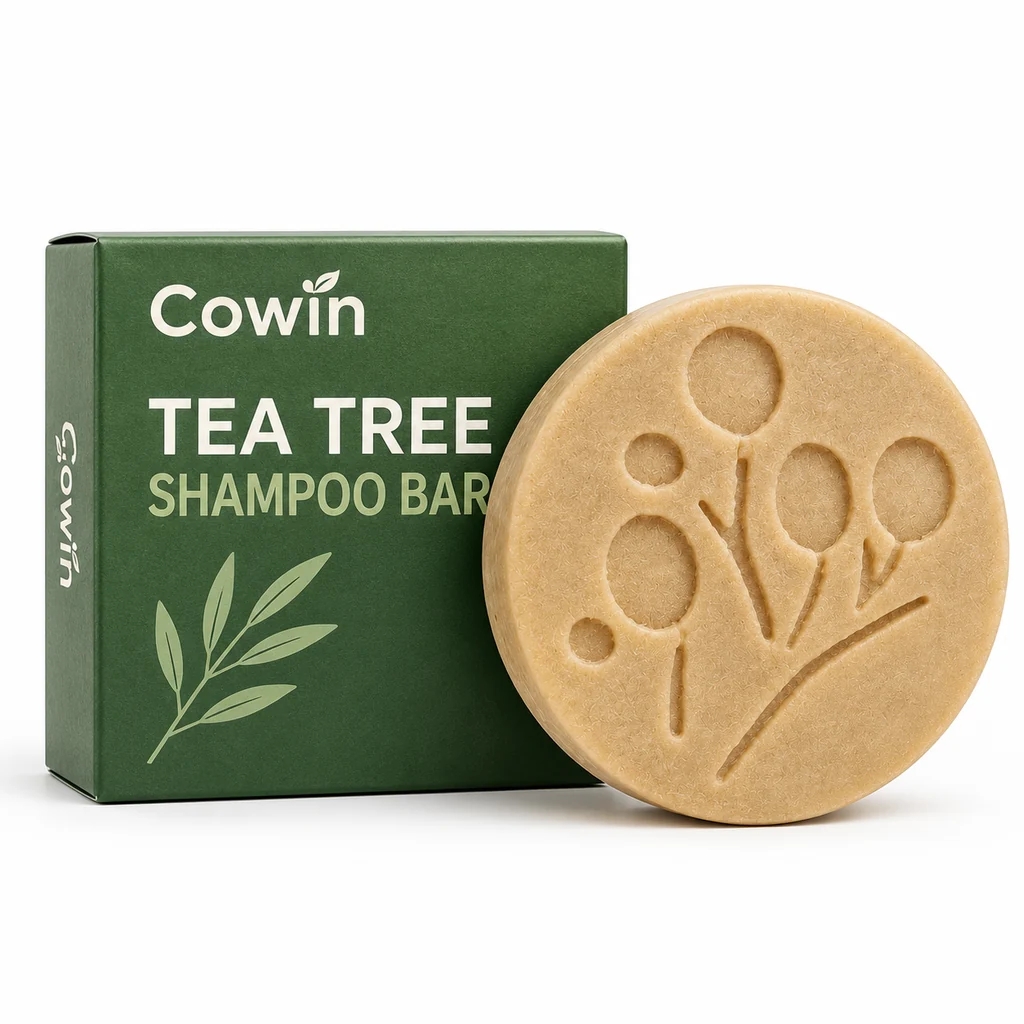 Cowin ivory embossed shampoo bar beside a dark green carton