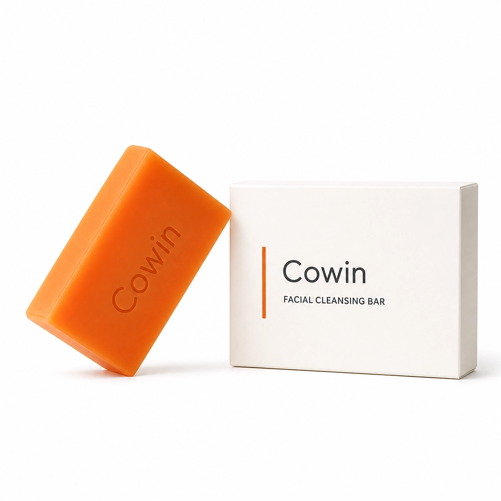 Cowin orange facial cleansing bar beside a white carton