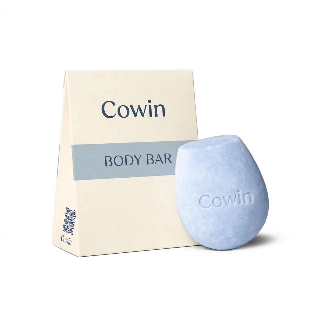 Cowin pale blue sculpted body bar beside a white carton
