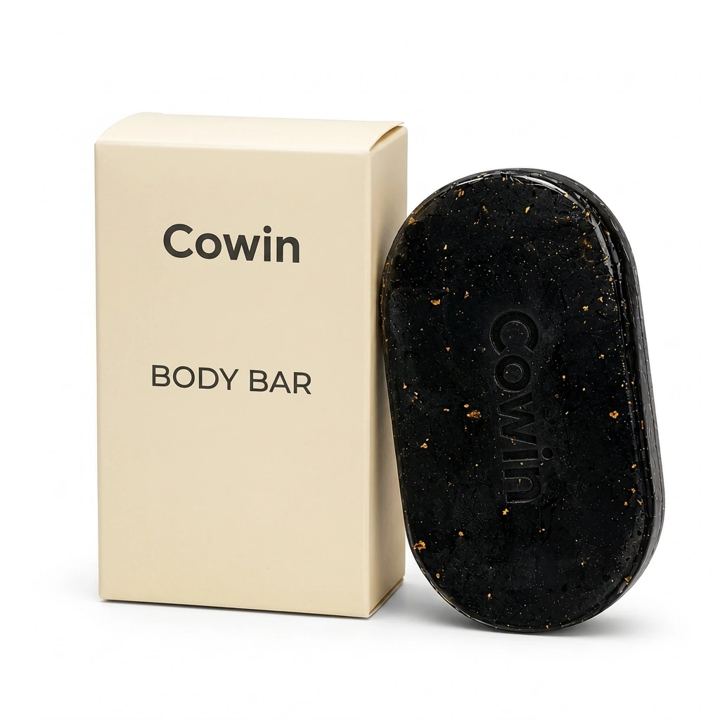 Cowin black oval body bar beside an ivory carton